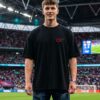 Unisex Oversized Black Graphic Printed Round Neck T-Shirt Bold Sports Inspired Back Print, Casual Streetwear, Half Sleeve Premium Cotton Tee