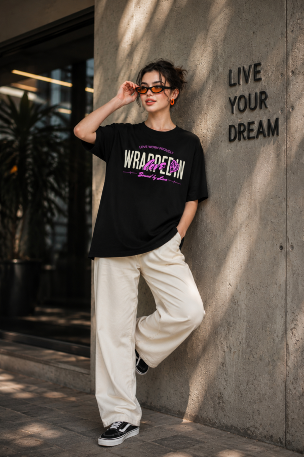 Women's Black Oversized Graphic T-Shirt Wear Your Heart on Your Sleeve Back Print | Premium Loopknit 240 GSM Cotton | Bold Pink & White Typography Design | Casual Streetwear Round Neck Tee for Daily Wear