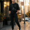 ChatGPT Image Jul 21, 2026, 12_36_37 PM Men Black Oversized Graphic T-Shirt with Crown Front Detail and Bold Tech-Inspired Back Print Streetwear Style