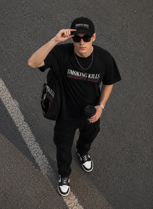 Black Oversized Graphic T-Shirt with Bold Typography Print and Back Artwork Design Paired with Matching Adjustable Cap and Printed Drawstring Bag Combo Set Streetwear Casual Outfit
