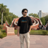 ChatGPT Image Jul 22, 2026, 12_39_37 PM Men's Black Oversized Graphic T-Shirt with Gen-Z Cockroach Front & Back Print | CJP Inspired Urban Streetwear Baggy Fit Tee for Men | Aesthetic Drop Shoulder Half Sleeve Round Neck Oversized T-Shirt | Premium Loopknit 240 GSM Heavy Fabric