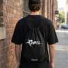 Rebel Graphic Oversized T-Shirt, Cap & Drawstring Bag Combo for Men | Streetwear Statement Set | Loopknit 240 GSM Cotton Tee + Adjustable Cap + Premium Carry Bag