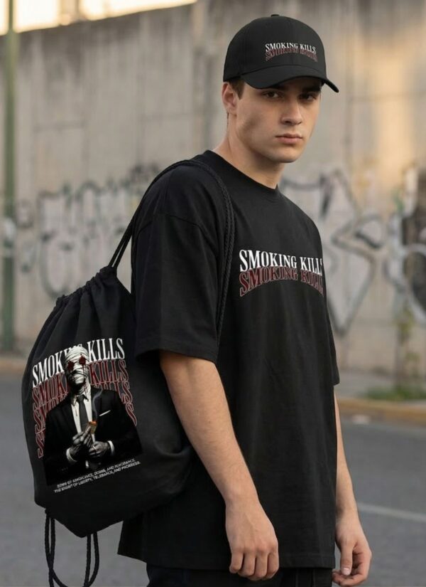Black Oversized Graphic T-Shirt with Bold Typography Print and Back Artwork Design Paired with Matching Adjustable Cap and Printed Drawstring Bag Combo Set Streetwear Casual Outfit