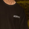 WMFOB_Trust_Nobody_1768043706737_awlcrdmrgtvqp9n.jpg Black Oversized Streetwear T-Shirt for Men | Trust Nobody Graphic Back Print | Loopknit Cotton 240 GSM