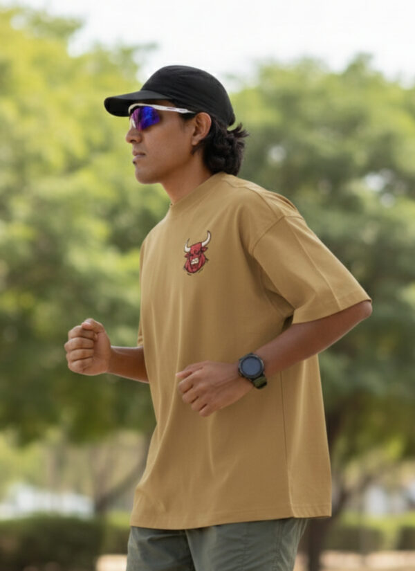 WMFOC_Rustom_1768043678789_hda7qd0y4jyei8y.jpg Camel Brown Bull Graphic Printed Men’s Oversized T-Shirt | Premium Loopknit Fabric 240 GSM | Minimal Front Logo & Bold Back Power Print Streetwear Tee – GiftSpeaks