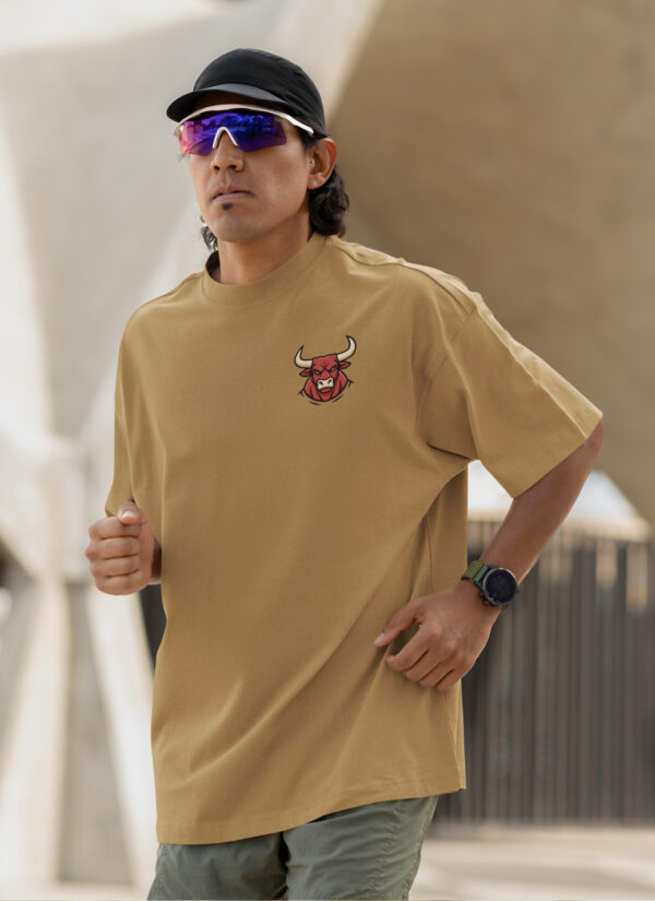WMFOC_Rustom_1768043778236_vmr6pg26yeb9y3z.jpg Camel Brown Bull Graphic Printed Men’s Oversized T-Shirt | Premium Loopknit Fabric 240 GSM | Minimal Front Logo & Bold Back Power Print Streetwear Tee – GiftSpeaks