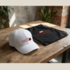 White Oversized Graphic T-Shirt with Front Typography Print and Back Comic Artwork Design Paired with Matching Adjustable Cap and Drawstring Bag Combo Set Streetwear Casual Everyday Outfit