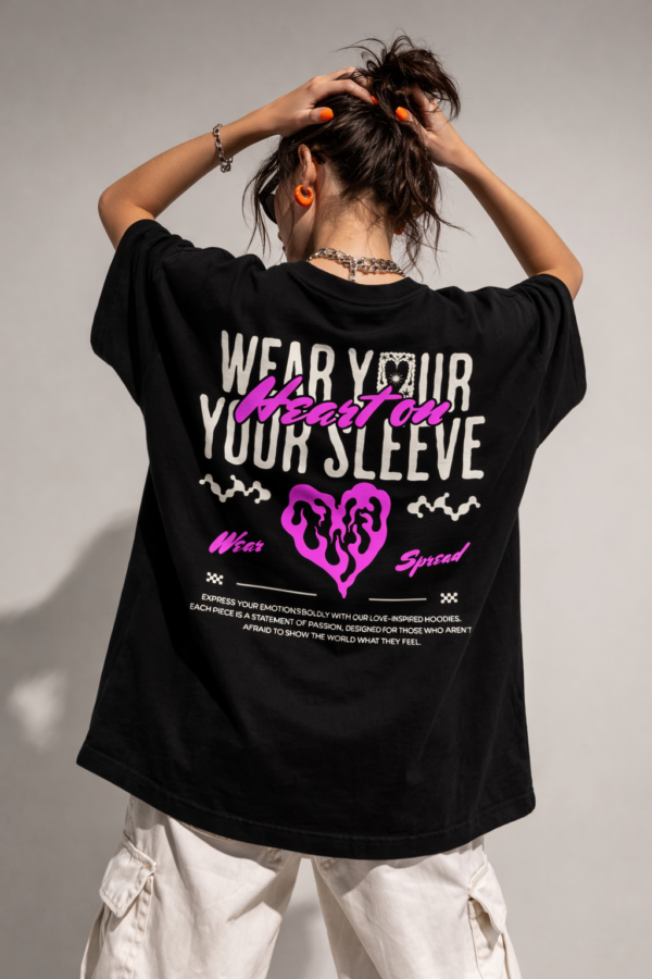WWFOB_Wear_your_sleeve_1772787503233_beehv3y2kd654mz.png Women's Black Oversized Graphic T-Shirt Wear Your Heart on Your Sleeve Back Print | Premium Loopknit 240 GSM Cotton | Bold Pink & White Typography Design | Casual Streetwear Round Neck Tee for Daily Wear
