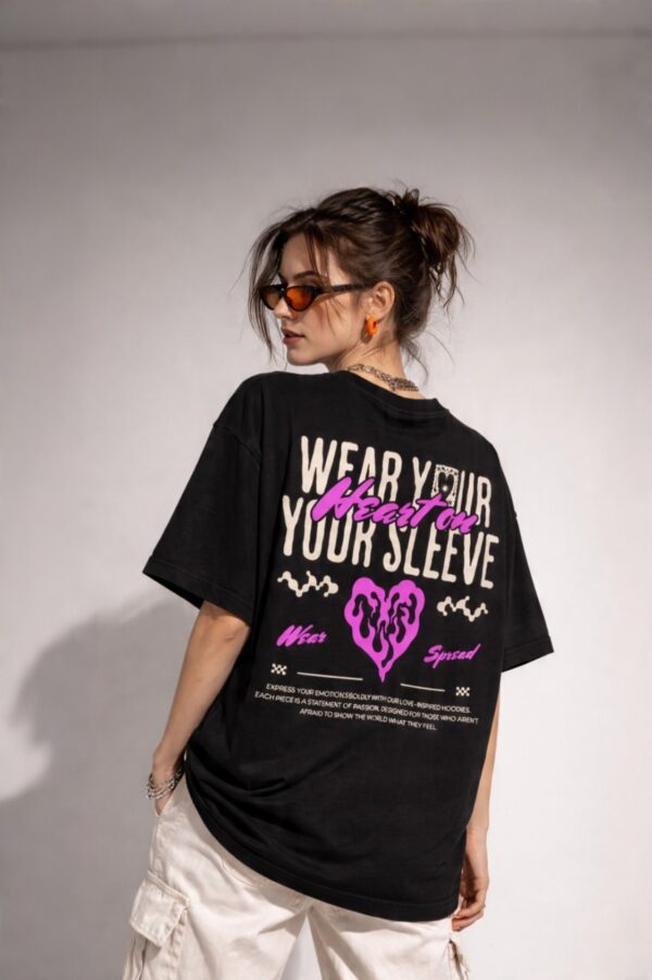 retouch_2026071713582546.jpg Women's Black Oversized Graphic T-Shirt Wear Your Heart on Your Sleeve Back Print | Premium Loopknit 240 GSM Cotton | Bold Pink & White Typography Design | Casual Streetwear Round Neck Tee for Daily Wear