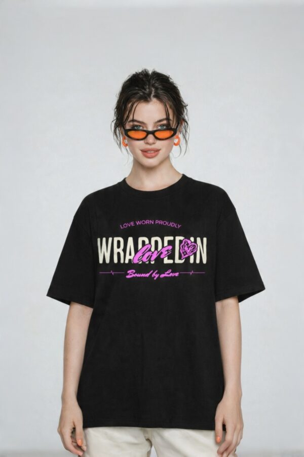 retouch_2026071713594053.jpg Women's Black Oversized Graphic T-Shirt Wear Your Heart on Your Sleeve Back Print | Premium Loopknit 240 GSM Cotton | Bold Pink & White Typography Design | Casual Streetwear Round Neck Tee for Daily Wear