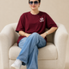 ChatGPT Image Sep 2, 2026, 10_35_30 AM Women’s Maroon Oversized T-Shirt with Lord Ganesha Back Print and Om Front Graphic, Loopknit 240 GSM Premium Fabric, Relaxed Loose Fit Half Sleeve Round Neck Casual Tee, Trendy Spiritual Streetwear Top for Women, Festive Wear, College, Outings & Everyday Styling