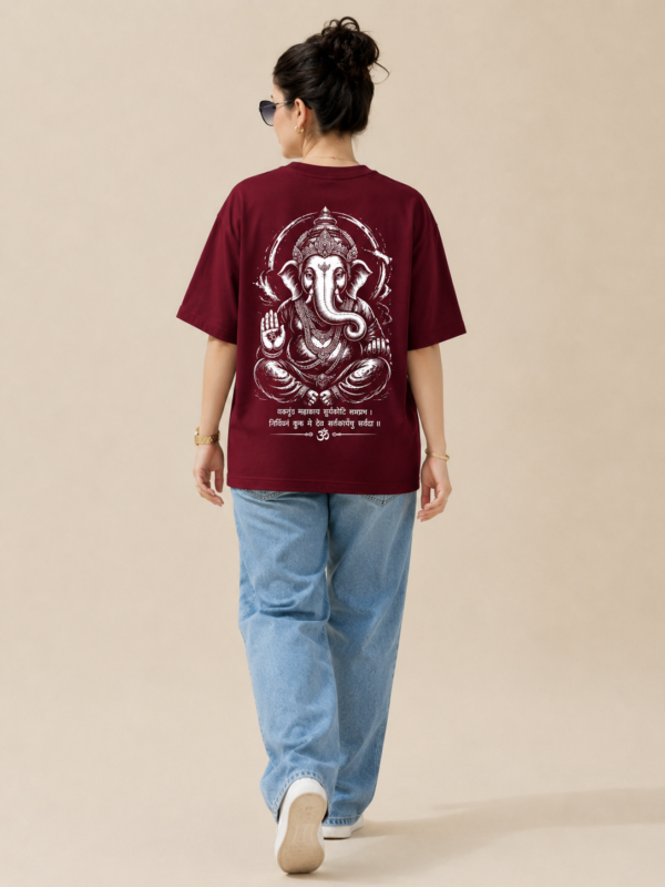 ChatGPT Image Sep 2, 2026, 10_36_46 AM Women’s Maroon Oversized T-Shirt with Lord Ganesha Back Print and Om Front Graphic, Loopknit 240 GSM Premium Fabric, Relaxed Loose Fit Half Sleeve Round Neck Casual Tee, Trendy Spiritual Streetwear Top for Women, Festive Wear, College, Outings & Everyday Styling