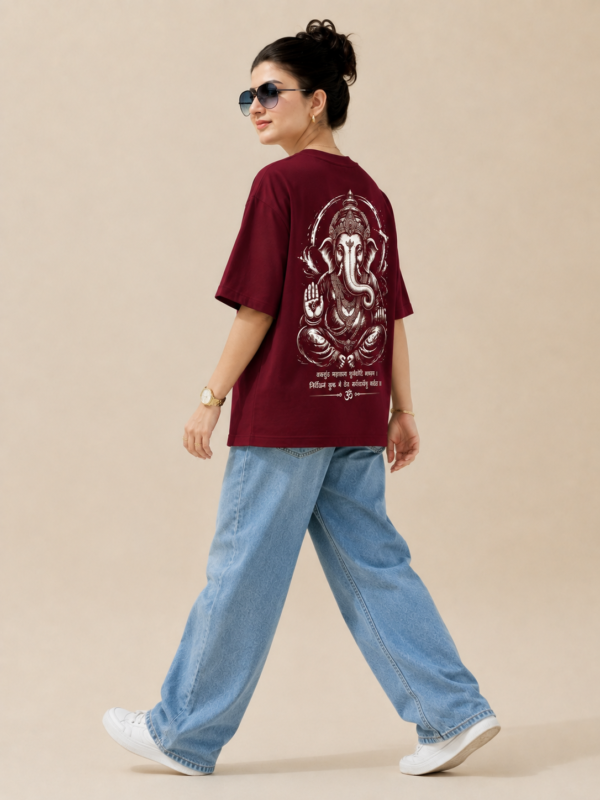 ChatGPT Image Sep 2, 2026, 10_37_49 AM Women’s Maroon Oversized T-Shirt with Lord Ganesha Back Print and Om Front Graphic, Loopknit 240 GSM Premium Fabric, Relaxed Loose Fit Half Sleeve Round Neck Casual Tee, Trendy Spiritual Streetwear Top for Women, Festive Wear, College, Outings & Everyday Styling