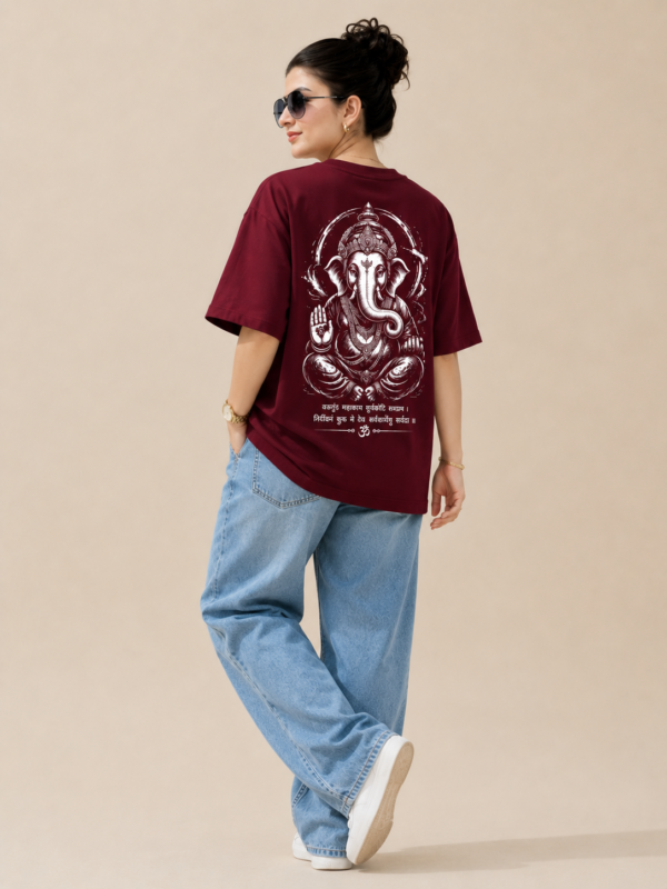 ChatGPT Image Sep 2, 2026, 10_39_31 AM Women’s Maroon Oversized T-Shirt with Lord Ganesha Back Print and Om Front Graphic, Loopknit 240 GSM Premium Fabric, Relaxed Loose Fit Half Sleeve Round Neck Casual Tee, Trendy Spiritual Streetwear Top for Women, Festive Wear, College, Outings & Everyday Styling
